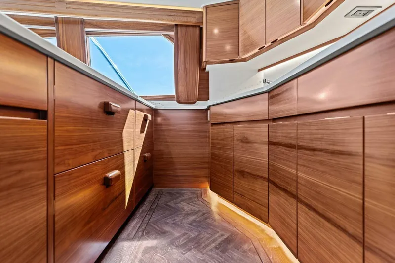 Olde Floridian Yacht Photos Pics Luxurious wooden interior of 2023 Vikiing convertible yacht kitchen.