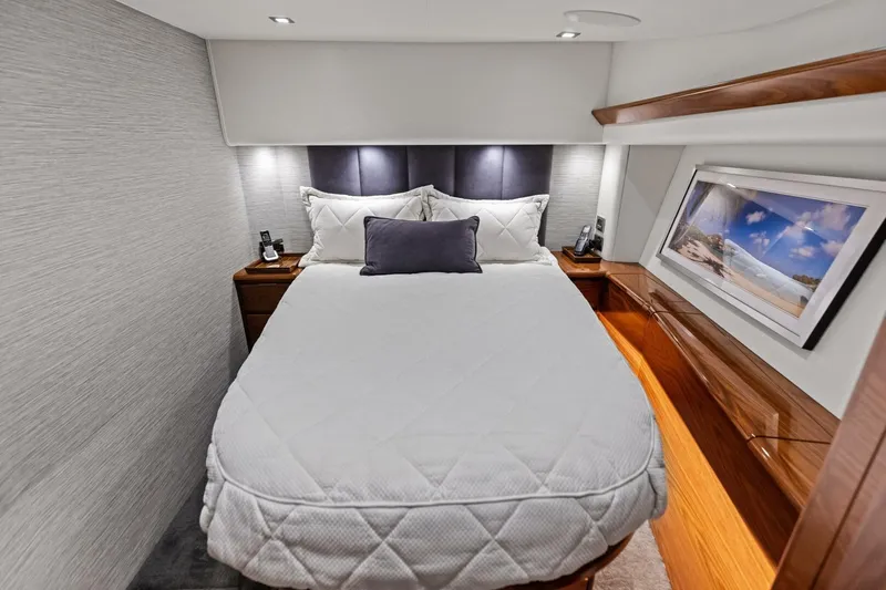 Olde Floridian Yacht Photos Pics Luxurious 2023 Vikiing convertible yacht bedroom with elegant bedding and modern decor.