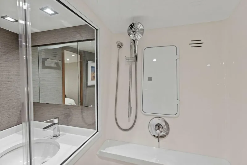Olde Floridian Yacht Photos Pics Modern bathroom in 2023 Vikiing convertible yacht with sleek fixtures and mirror.