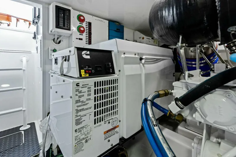 Olde Floridian Yacht Photos Pics Engine room of 2023 Vikiing convertible yacht with Cummins generator and control panels.