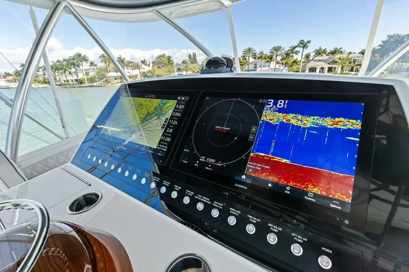 Olde Floridian Yacht Photos Pics 2023 Vikiing convertible yacht dashboard with advanced navigation and sonar displays.