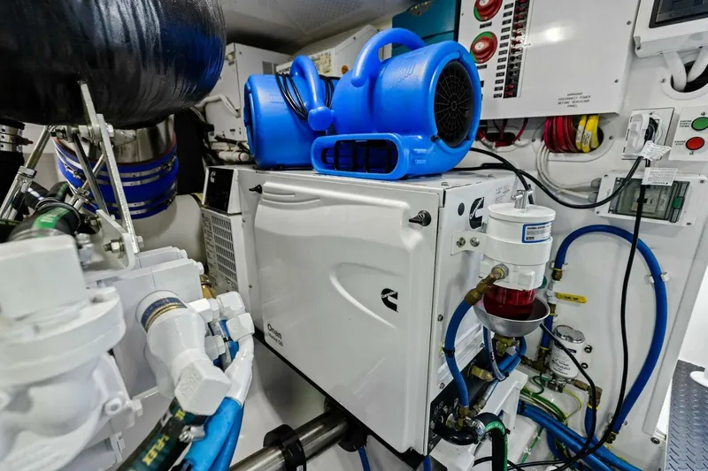 Olde Floridian Yacht Photos Pics Engine room of 2023 Vikiing convertible with Cummins generator and blue air mover.