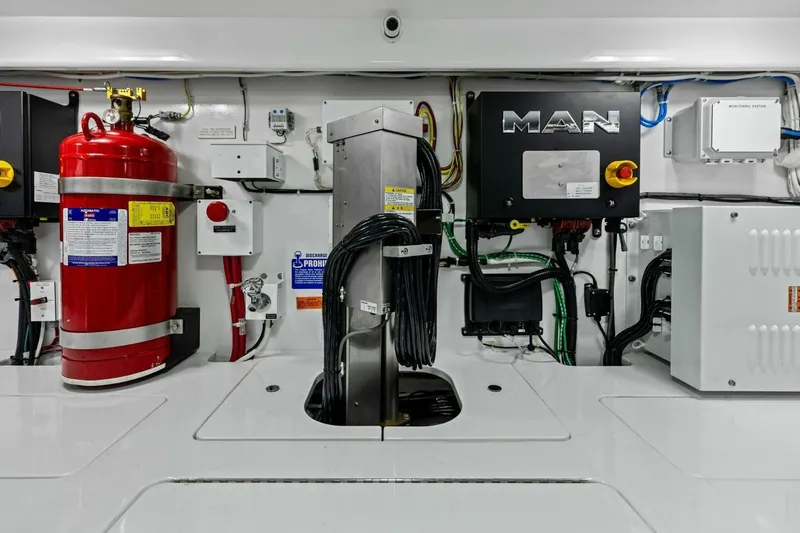Olde Floridian Yacht Photos Pics Engine room of 2023 Vikiing convertible with fire extinguisher and control systems.