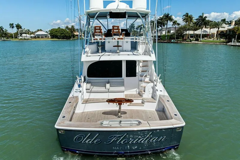 Olde Floridian Yacht Photos Pics 2023 Vikiing convertible yacht on serene water, featuring luxurious deck and seating.