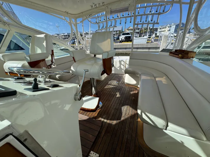 Stewartship Yacht Photos Pics 2007 Albemarle 410 Express Fisherman interior with white seating and wooden flooring.