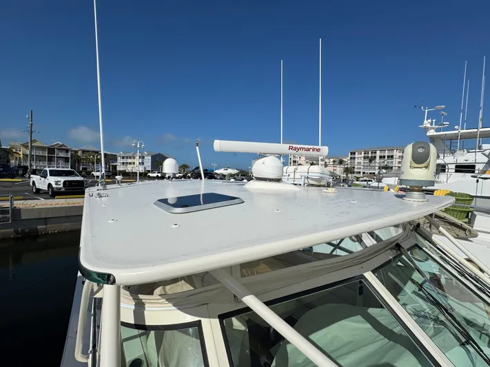 Stewartship Yacht Photos Pics 2007 Albemarle 410 Express Fisherman boat with Raymarine radar at marina.