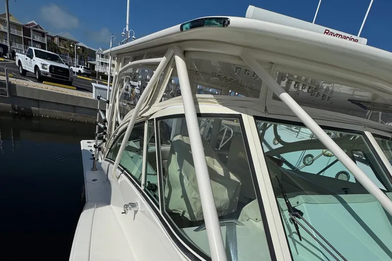 Stewartship Yacht Photos Pics 2007 Albemarle 410 Express Fisherman docked, showcasing sleek design and sturdy structure.