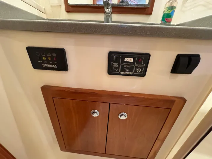 Stewartship Yacht Photos Pics Control panel and cabinet on 2007 Albemarle 410 Express Fisherman boat interior.