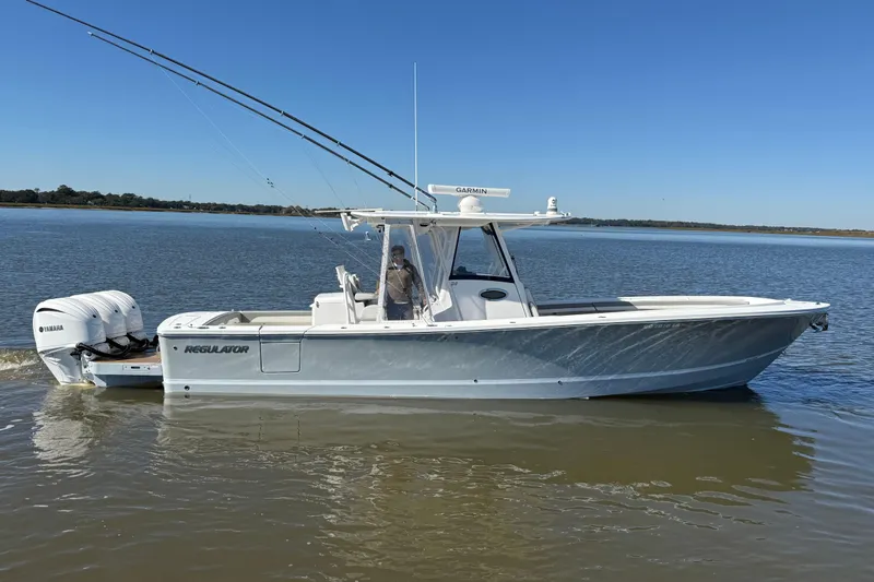  Yacht Photos Pics 2022 Regulator 34 boat with dual Yamaha engines on calm water.