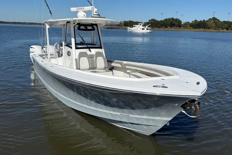  Yacht Photos Pics 2022 Regulator 34 boat on calm water with clear blue sky.