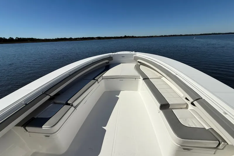  Yacht Photos Pics 2022 Regulator 34 boat with spacious seating on calm water.