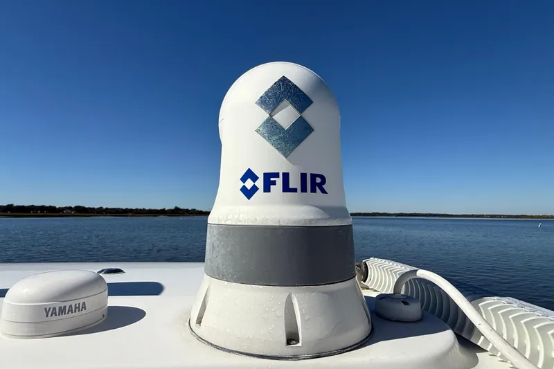  Yacht Photos Pics FLIR radar on 2022 Regulator 34 boat, with Yamaha equipment, against clear blue sky.