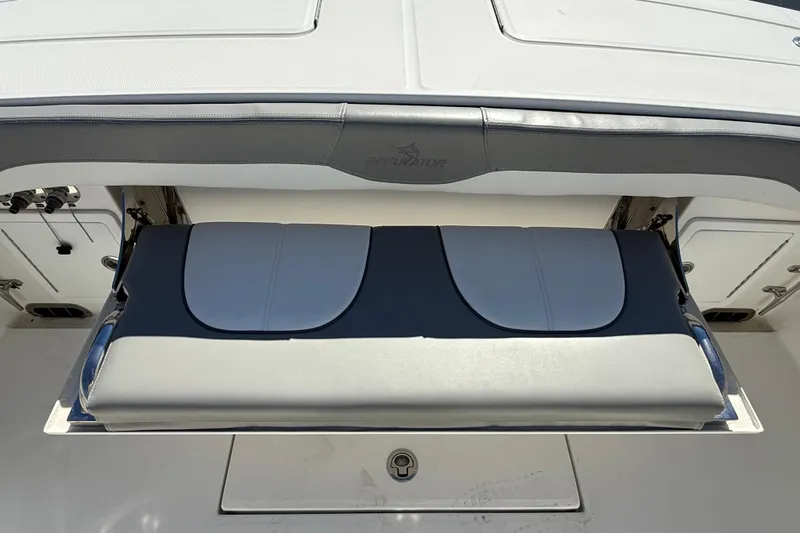  Yacht Photos Pics 2022 Regulator 34 boat with foldable seating and storage compartment.