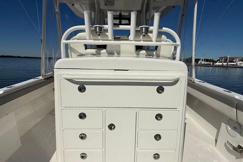  Yacht Photos Pics 2022 Regulator 34 boat interior with storage drawers, on calm water.