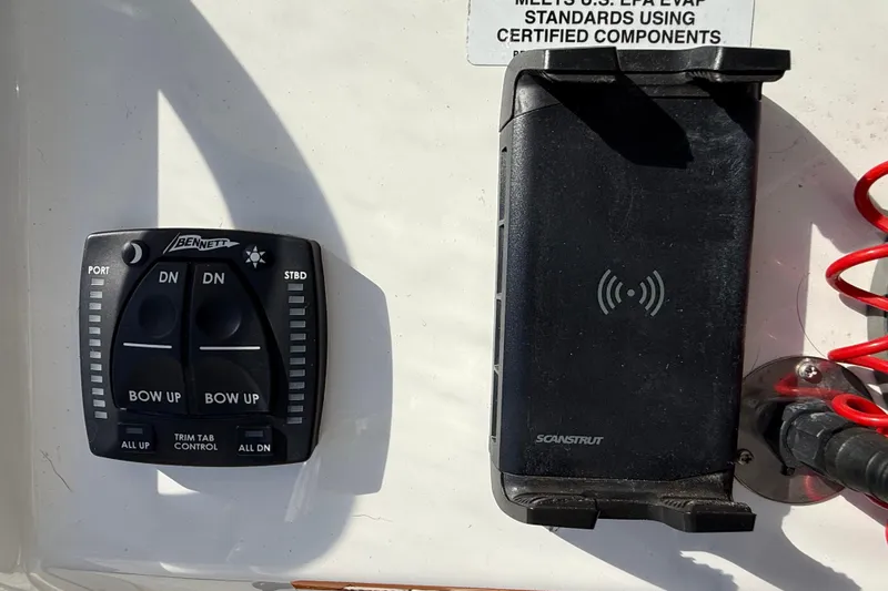  Yacht Photos Pics Control panel and phone holder on 2022 Regulator 34 boat dashboard.