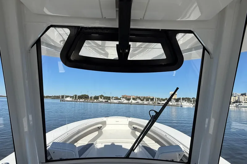  Yacht Photos Pics 2022 Regulator 34 boat interior view through windshield at marina.