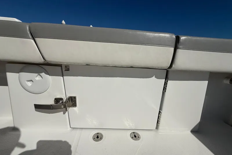  Yacht Photos Pics 2022 Regulator 34 boat interior with cushioned seating and storage compartment.