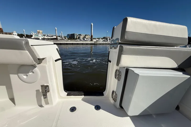  Yacht Photos Pics 2022 Regulator 34 boat interior with open water view, featuring sleek seating and storage.