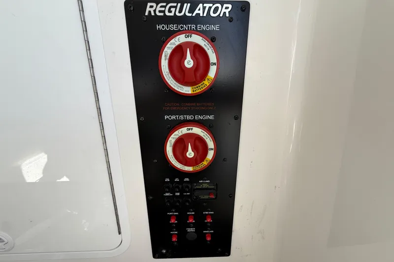  Yacht Photos Pics Control panel of a 2022 Regulator 34 boat with engine switches and indicators.