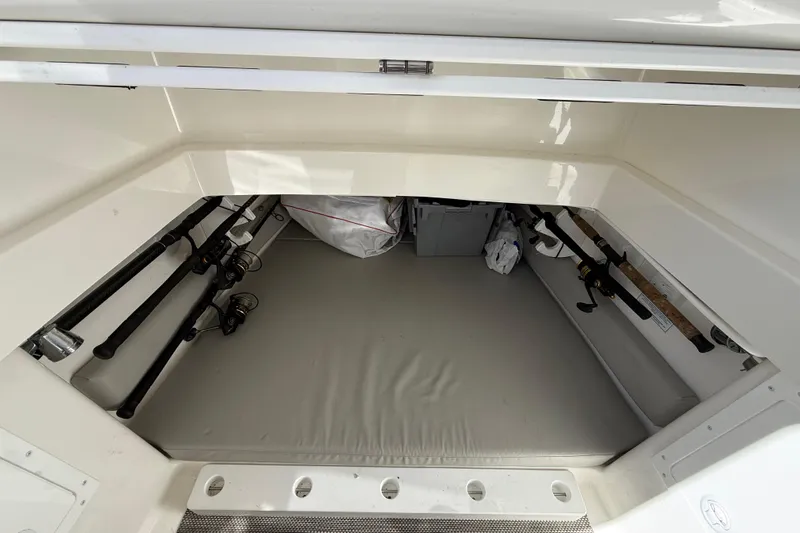  Yacht Photos Pics Storage compartment with fishing rods in a 2022 Regulator 34 boat.