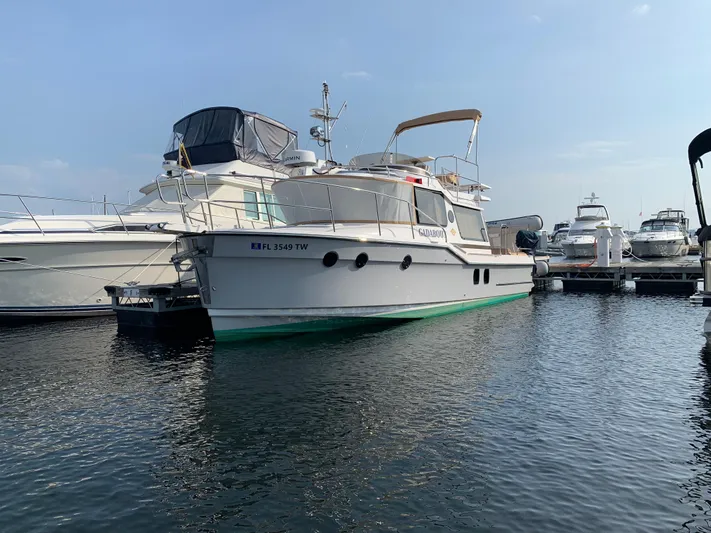 Gadabout Yacht Photos Pics 2024 Ranger Tugs R-29 CB yacht docked at marina, surrounded by other boats.