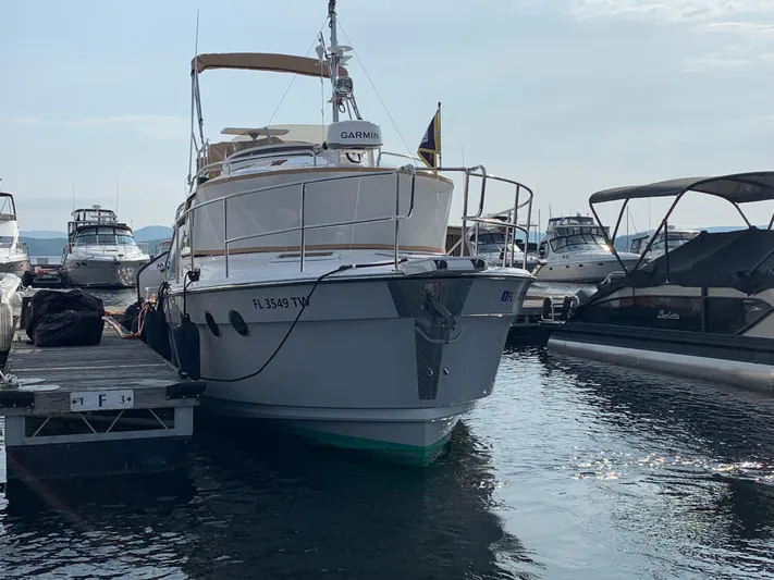 Gadabout Yacht Photos Pics 2024 Ranger Tugs R-29 CB docked at marina, surrounded by other boats.