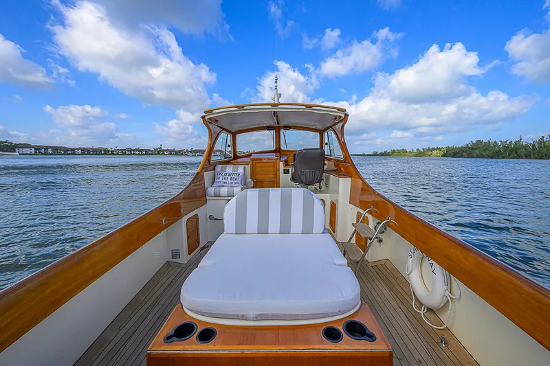 Lucky Town Yacht Photos Pics 2000 Hinckley Picnic Boat Classic on water, featuring elegant wooden deck and seating.