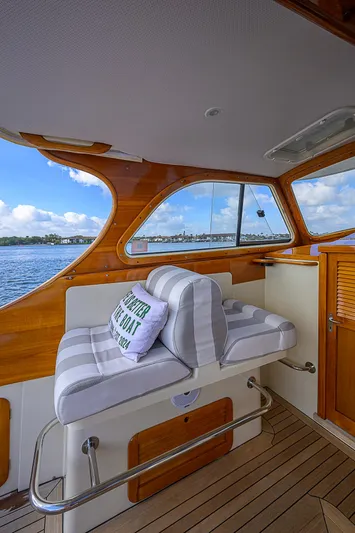 Lucky Town Yacht Photos Pics Hinckley Picnic Boat Classic 2000 interior with striped seating and scenic water view.