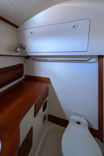 Lucky Town Yacht Photos Pics 2000 Hinckley Picnic Boat Classic interior with wooden cabinetry and compact bathroom.