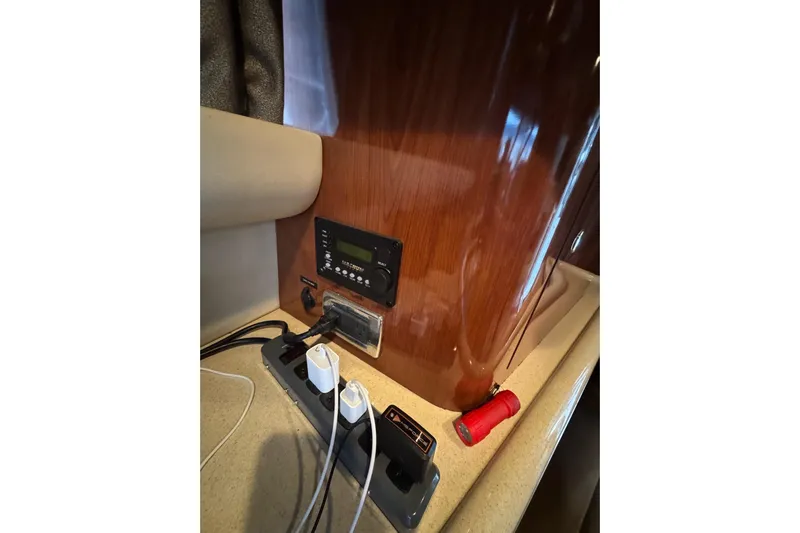  Yacht Photos Pics Control panel and power strip inside 2003 Sea Ray 480 Sedan Bridge yacht cabin.