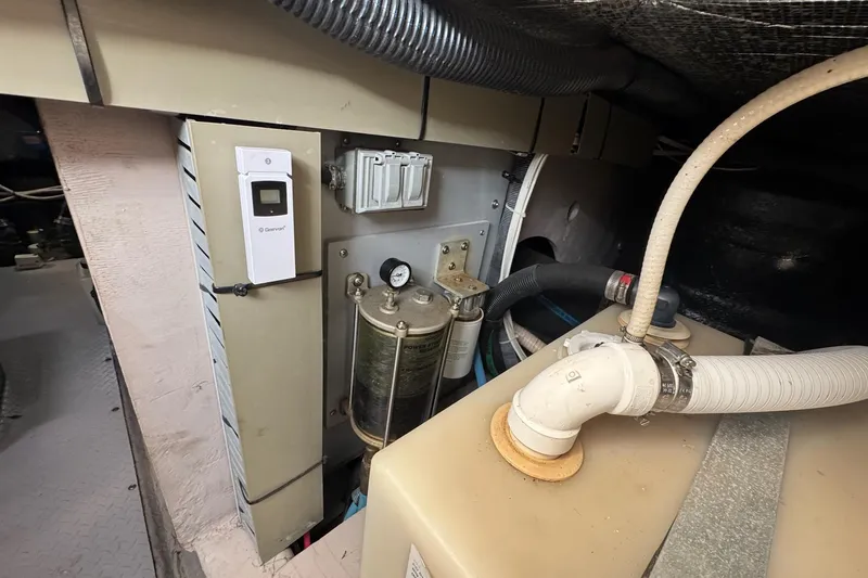  Yacht Photos Pics Engine room of 2003 Sea Ray 480 Sedan Bridge with mechanical components and piping.