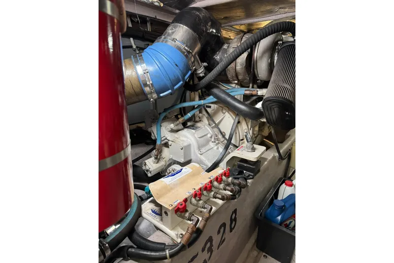  Yacht Photos Pics Engine compartment of a 2003 Sea Ray 480 Sedan Bridge yacht, showcasing mechanical components.