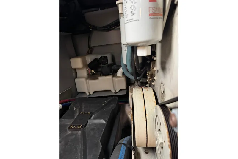  Yacht Photos Pics Engine compartment of a 2003 Sea Ray 480 Sedan Bridge, showing filters and belts.