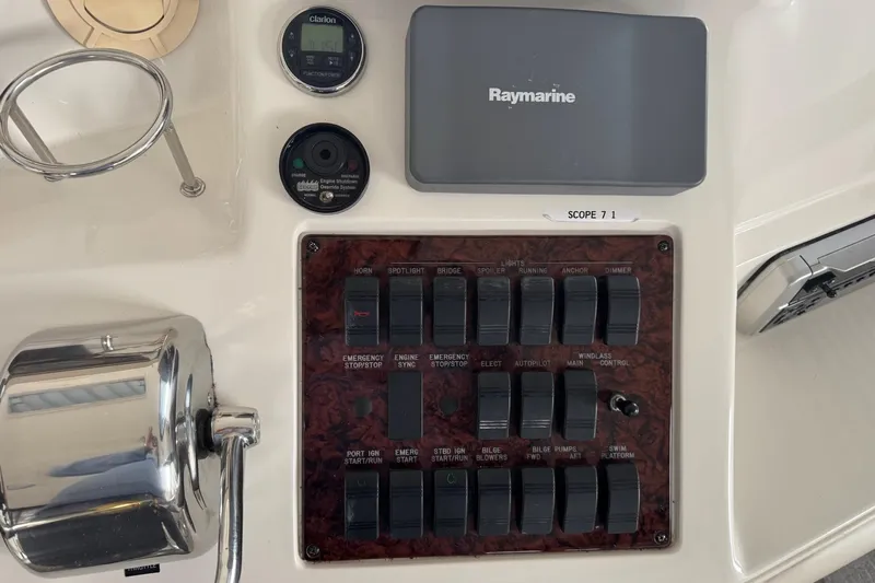  Yacht Photos Pics Control panel of a 2003 Sea Ray 480 Sedan Bridge with switches and Raymarine equipment.