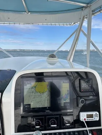  Yacht Photos Pics 2006 Contender 36 Fisharound boat dashboard with navigation equipment on open water.