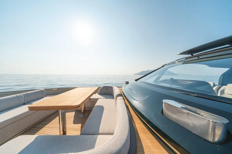  Yacht Photos Pics Luxury Invictus TT550 yacht interior, 2025 model, with elegant seating and ocean view.