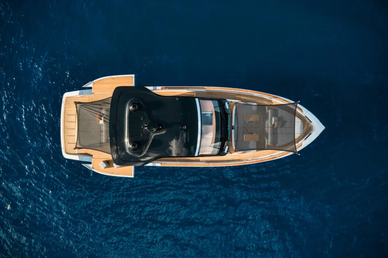  Yacht Photos Pics Overhead view of 2025 Invictus TT550 yacht on deep blue water.