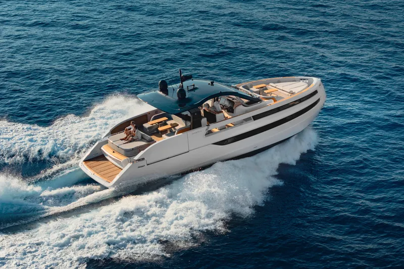  Yacht Photos Pics 2025 Invictus TT550 yacht cruising on open sea, showcasing sleek design and luxury features.