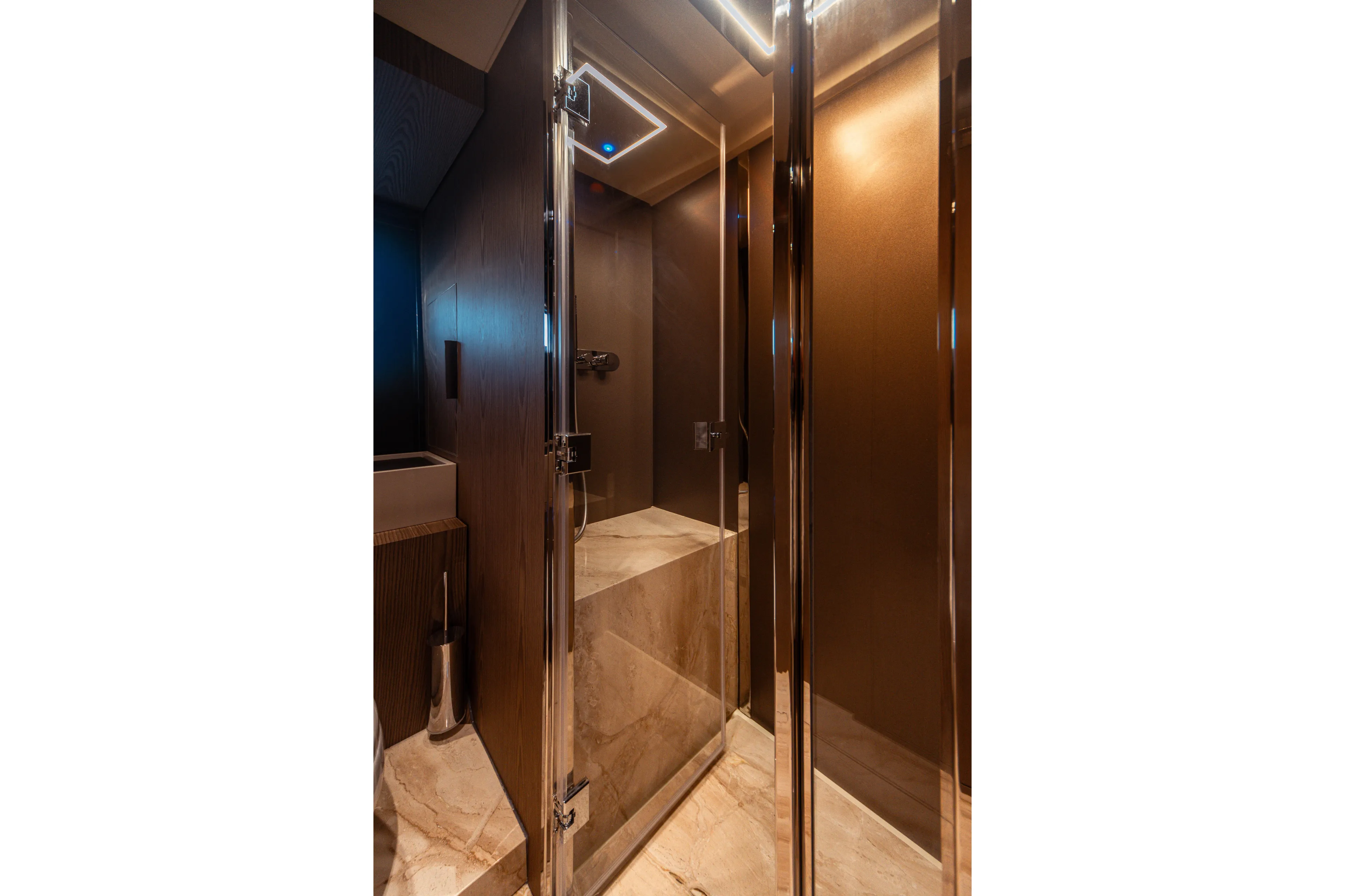  Yacht Photos Pics Luxurious bathroom interior of 2025 Invictus TT550 yacht with modern shower design.