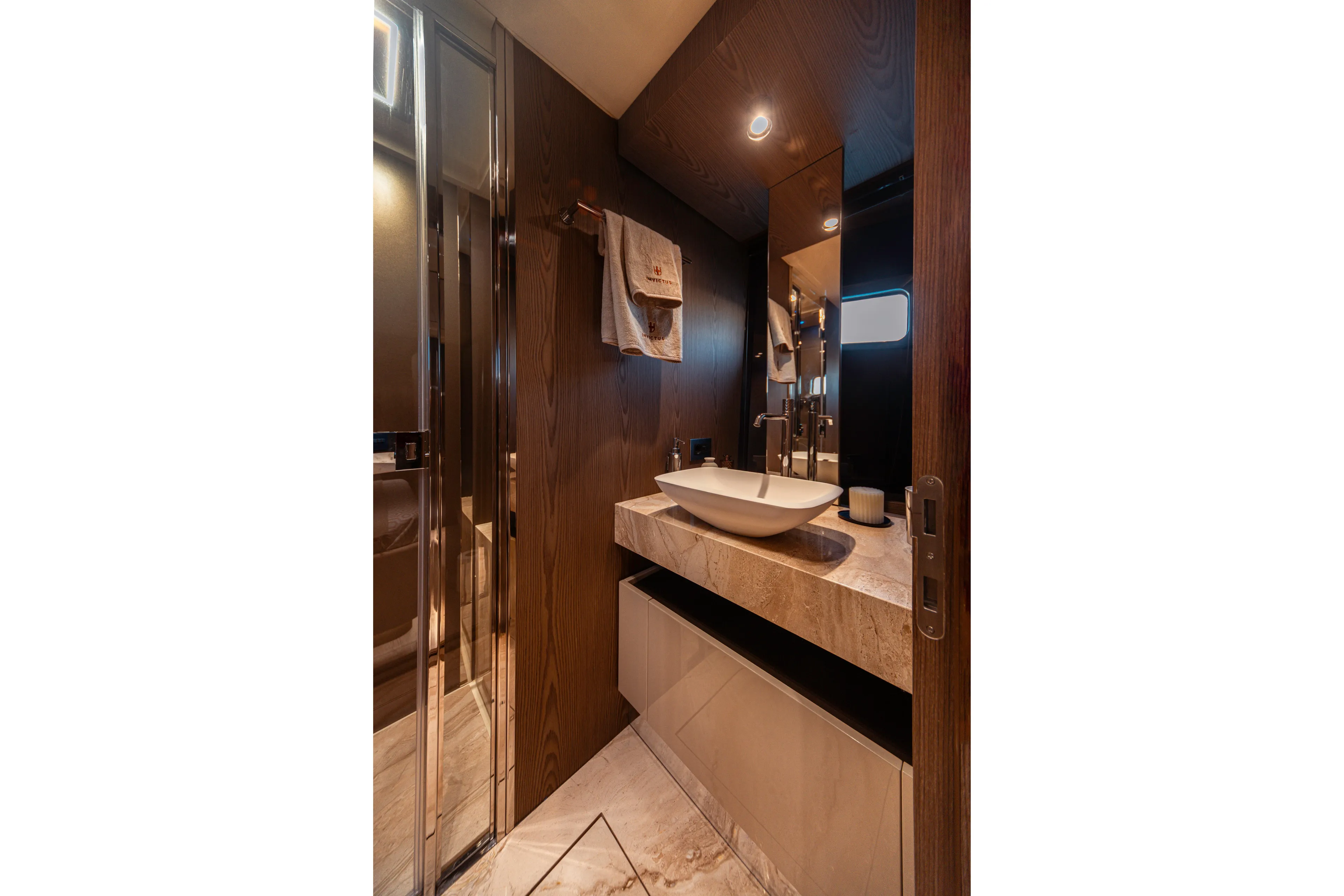  Yacht Photos Pics Luxurious bathroom interior of 2025 Invictus TT550 yacht with modern fixtures and elegant design.