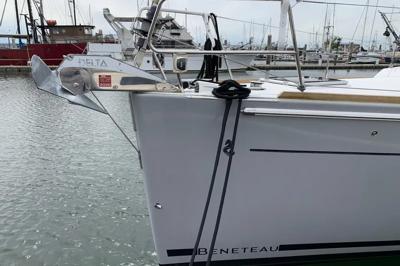 V-1 Yacht Photos Pics Beneteau Oceanis 45 sailboat, 2018 model, docked with visible anchor and marina background.