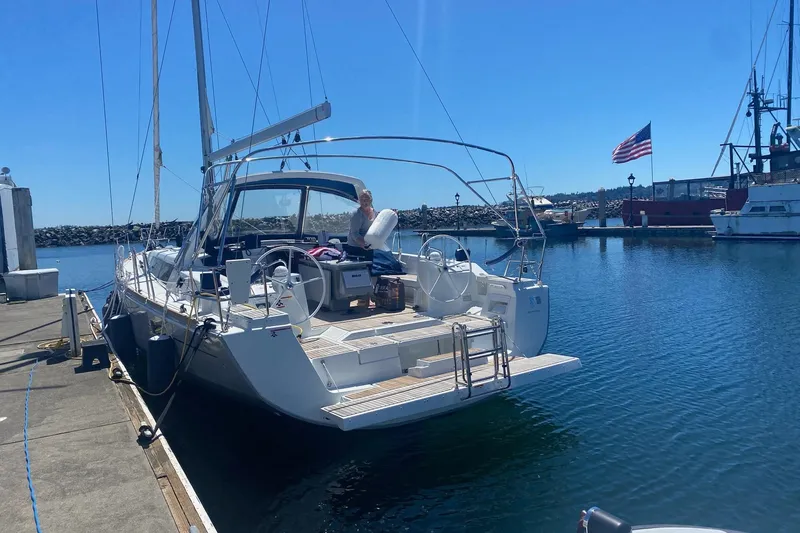 V-1 Yacht Photos Pics 2018 Beneteau Oceanis 45 yacht docked at marina under clear blue sky.