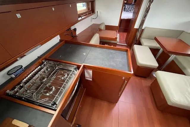 V-1 Yacht Photos Pics Interior of 2018 Beneteau Oceanis 45 yacht with modern kitchen and seating area.