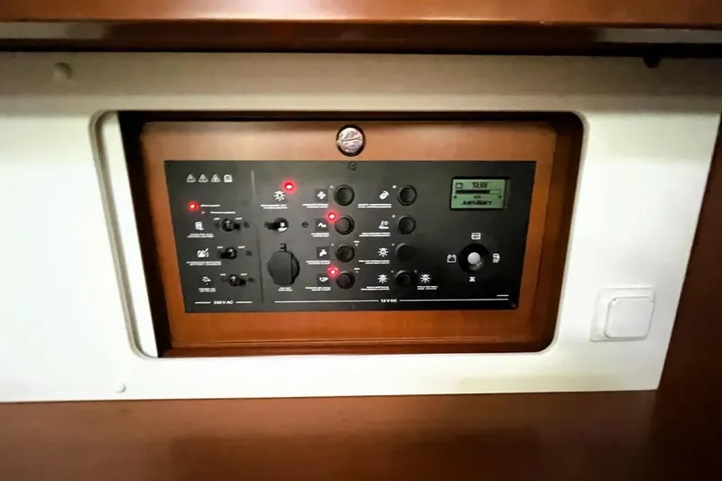 V-1 Yacht Photos Pics Control panel of a 2018 Beneteau Oceanis 45 yacht, featuring various switches and indicators.
