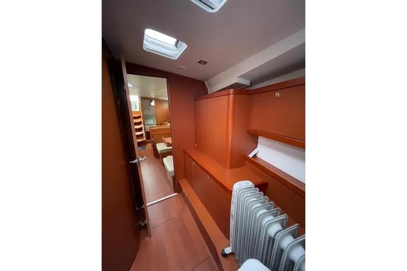 V-1 Yacht Photos Pics Interior of 2018 Beneteau Oceanis 45 yacht, featuring wooden cabinetry and modern design.