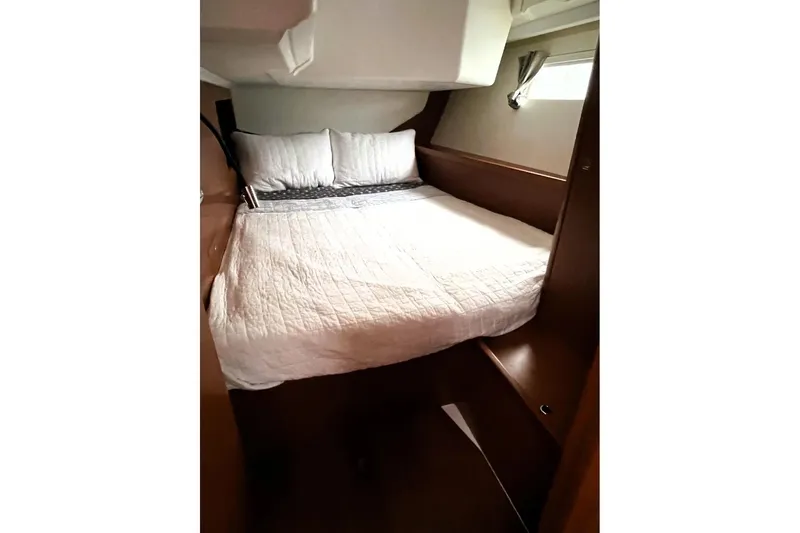 V-1 Yacht Photos Pics Cozy cabin interior of 2018 Beneteau Oceanis 45 yacht with comfortable bedding.