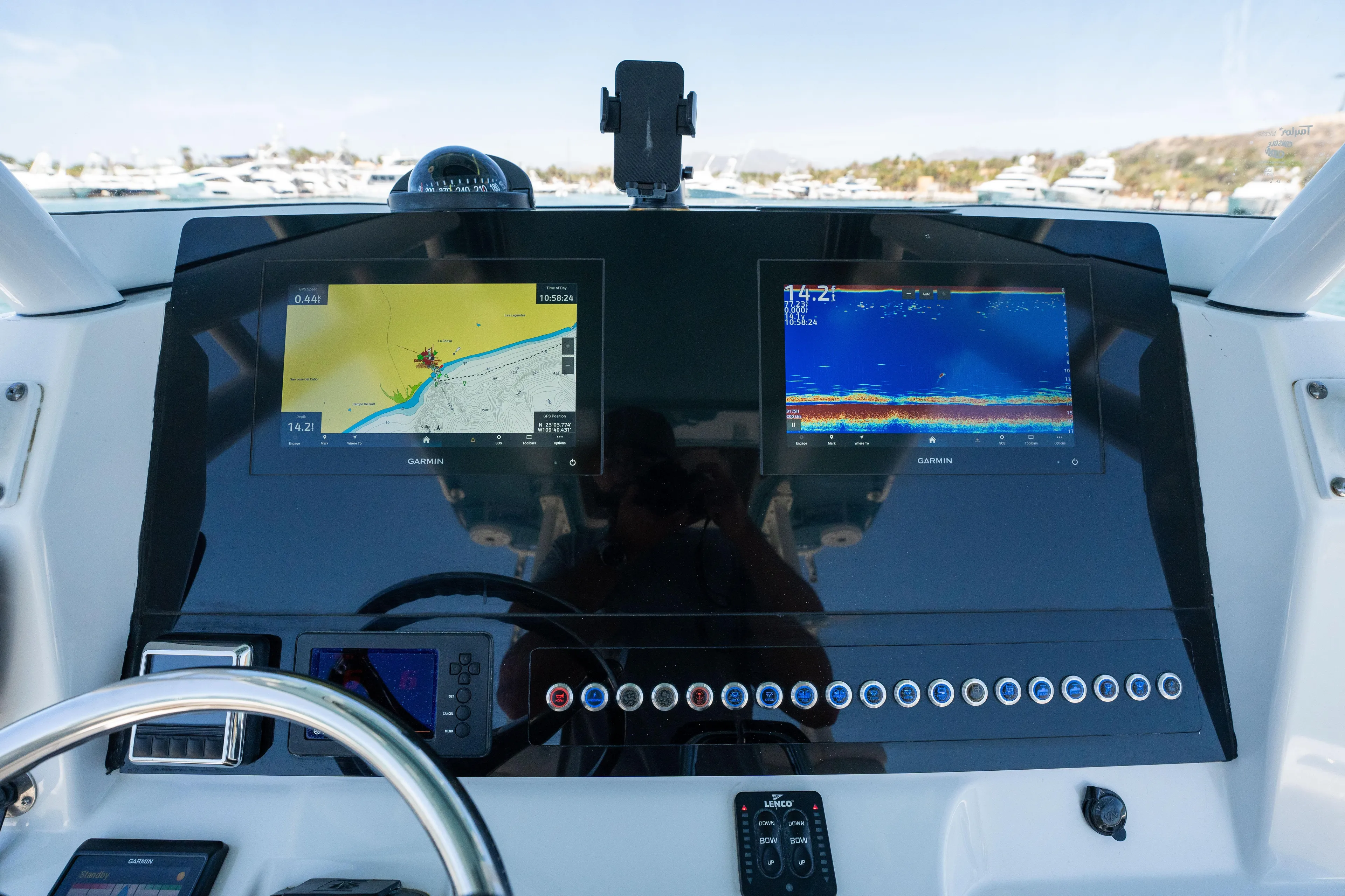 Carnal Yacht Photos Pics Dashboard of 2020 Edgewater 320CC boat with navigation and sonar displays.
