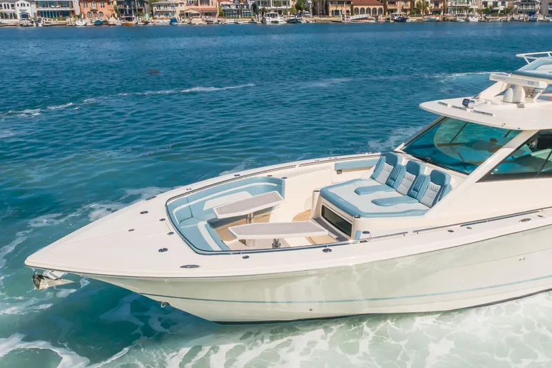 Mandalorian Yacht Photos Pics 2023 Scout 530 LXF luxury boat cruising on clear blue water.