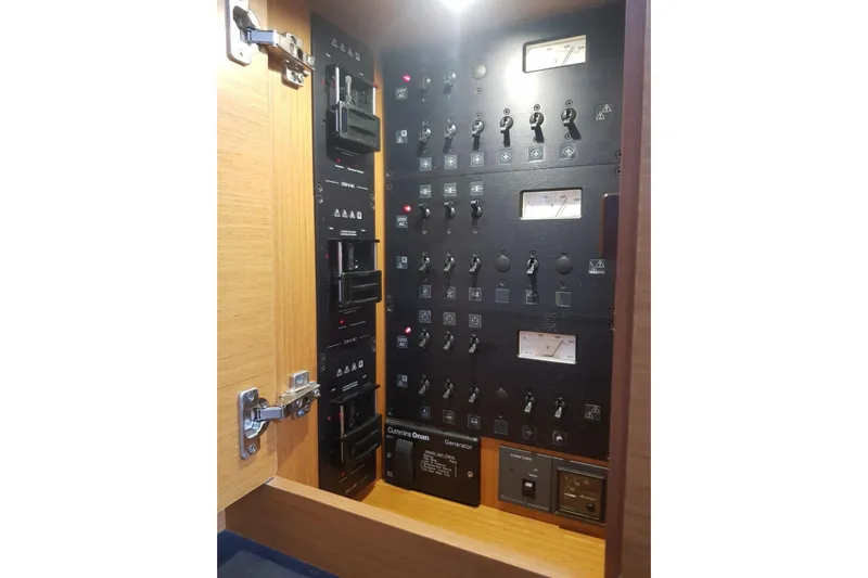  Yacht Photos Pics Electrical control panel inside a 2015 Jeanneau 57 yacht, featuring switches and meters.