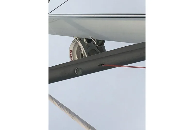  Yacht Photos Pics Close-up of Jeanneau 57 sailboat rigging, 2015 model, featuring pulley and lines.
